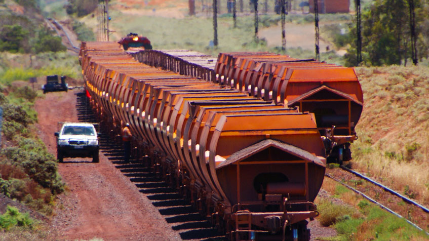 Image Caption: A GWA employee carries out work on one of the iron ore trains. At an average weight of 5250 tonnes fully loaded, this highlights the sheer size of a train compared to a person / light vehicle and the serious risk it poses to any members of the public interacting with them.