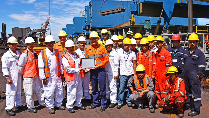Liberty OneSteel’s Whyalla Steelworks Executive General Manager, Theuns Victor, centre, presents a plaque to the captain and crew of the MV Western Miami to signal the historic first export of steel slabs to Liberty Steel Newport in Wales.